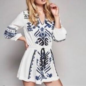 NWT Free People White Drawstring Tunic with black and blue embroidery.